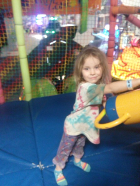 A Day at a Local Fun House. Isn't she cute? She's shooting rubber balls from an air cannon. That's my Montana girl!
